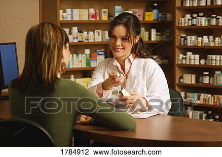 Pharmacist with patient View Large Photo Image Stock Image - Pharmacist with patient. Fotosearch