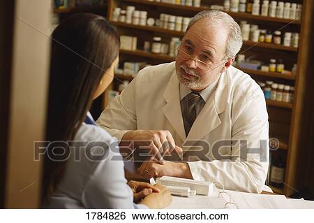 Pharmacist with patient View Large Photo Image Stock Photograph - Pharmacist with patient. Fotosearch