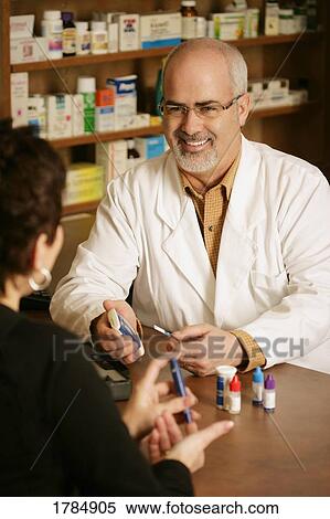 Pharmacist with patient View Large Photo Image Stock Photography - Pharmacist with patient. Fotosearch