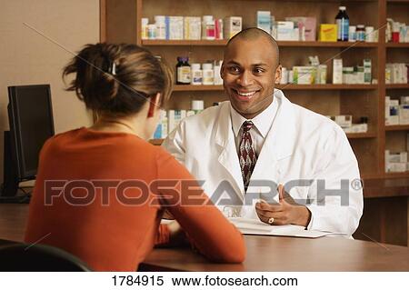 Pharmacist with patient View Large Photo Image Stock Photography - Pharmacist with patient. Fotosearch