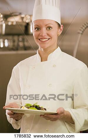 Stock Image - Portrait of female chef. Fotosearch