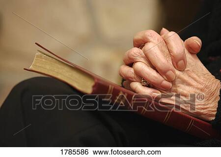 Stock Photograph - Praying hands. Fotosearch