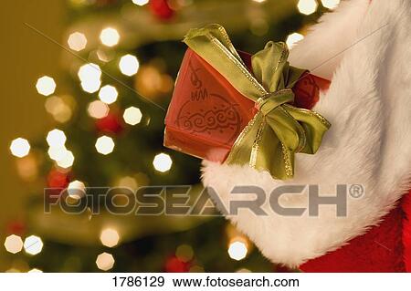 Present in a stocking View Large Photo Image Stock Photo - Present in a stocking. Fotosearch