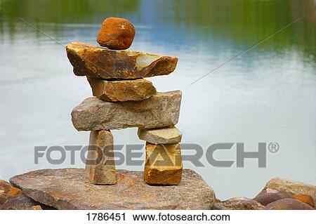 Stock Image - Rocks stacked to form a figure. Fotosearch