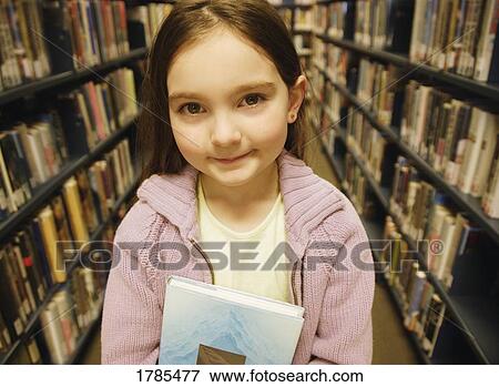 School girl at a library View Large Photo Image Stock Photo - School girl at a library. Fotosearch