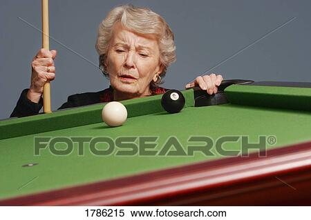 Senior analyzing pool shot View Large Photo Image Stock Photography - Senior analyzing pool shot. Fotosearch