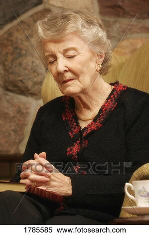 Senior lady praying View Large Photo Image Stock Photography - Senior lady praying. Fotosearch