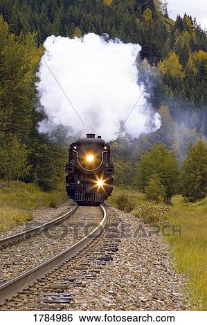 Steam Train on Tracks View Large Photo Image Stock Photograph - Steam Train on Tracks. Fotosearch