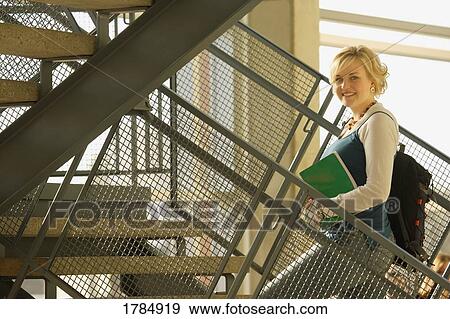 Student going up the stairs View Large Photo Image Stock Photo - Student going up the stairs. Fotosearch