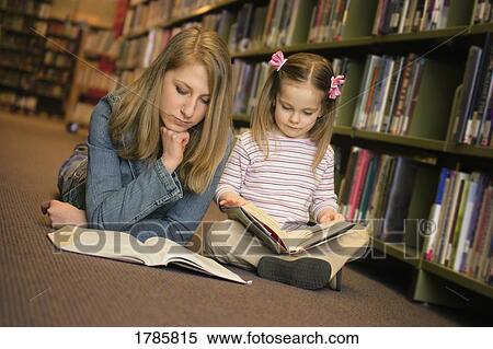 Studying in a library View Large Photo Image Stock Photography - Studying in a library. Fotosearch