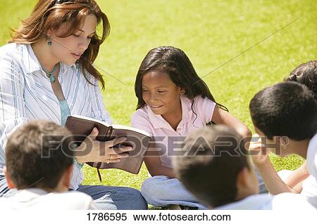 Stock Photography - Teaching a group of children. Fotosearch