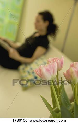 Stock Image - Tulips and woman. Fotosearch