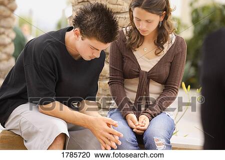 Two teens praying together View Large Photo Image Stock Image - Two teens praying together. Fotosearch