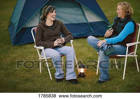 Two women camping View Large Photo Image Stock Photo - Two women camping. Fotosearch
