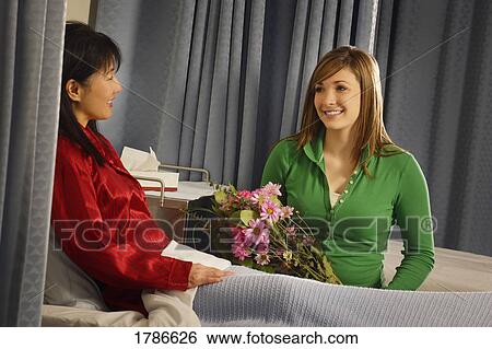 Stock Photograph - Visiting patient in hospital. Fotosearch