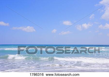 Waves rolling in View Large Photo Image Stock Photograph - Waves rolling in. Fotosearch