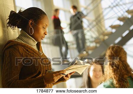 Woman reviewing documents View Large Photo Image Stock Photo - Woman reviewing documents. Fotosearch