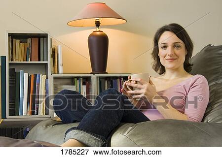 Stock Photo - Woman with a drink. Fotosearch