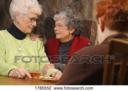Women praying for each other View Large Photo Image Stock Image - Women praying for each other. Fotosearch