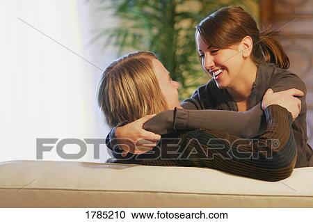 Young couple laughing View Large Photo Image Stock Image - Young couple laughing. Fotosearch