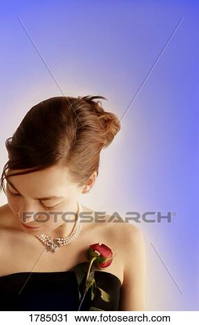 Young elegant woman with rose View Large Photo Image Stock Image - Young elegant woman with rose. Fotosearch
