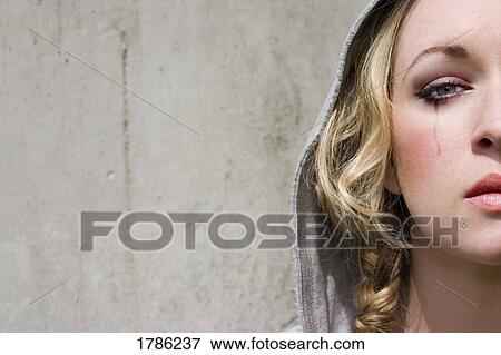 Stock Photo - Young woman crying. Fotosearch