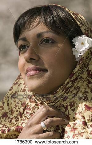Young woman with traditional head scarf View Large Photo Image Stock Image - Young woman with traditional head scarf. Fotosearch