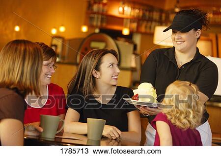Young women eating out View Large Photo Image Stock Image - Young women eating out. Fotosearch
