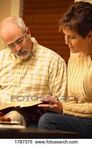 Stock Photography - A couple reads the Word together. Fotosearch