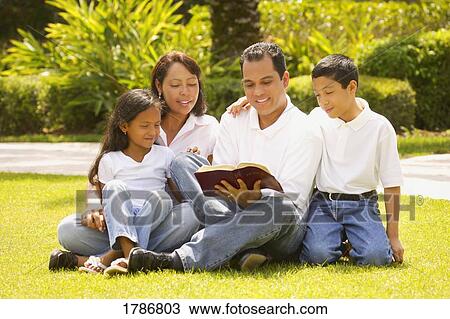 Stock Image - A family reading together. Fotosearch