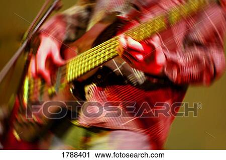 Bass guitar player with motion blur View Large Photo Image Stock Image - Bass guitar player with motion blur. Fotosearch
