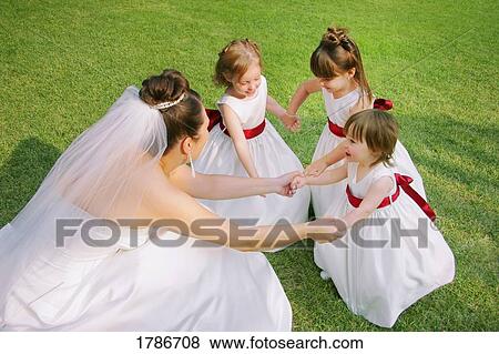 Bride and flower girls View Large Photo Image Stock Photo - Bride and flower girls. Fotosearch