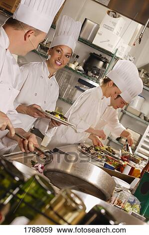 Chef's in a kitchen View Large Photo Image Stock Photo - Chef's in a kitchen. Fotosearch