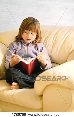Stock Photo - Child reading a book. Fotosearch