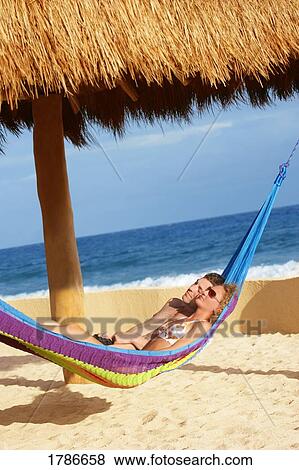 Stock Photo - Couple in hammock. Fotosearch