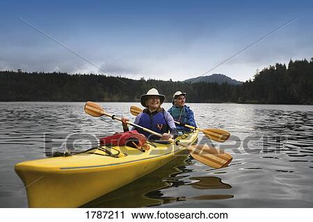 Couple kayaking View Large Photo Image Stock Image - Couple kayaking. Fotosearch