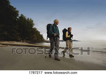 Couple on hike View Large Photo Image Stock Photo - Couple on hike. Fotosearch