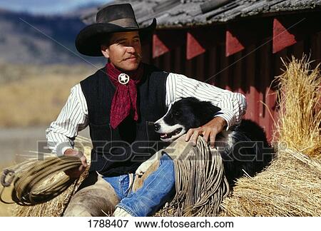 Cowboy and dog View Large Photo Image Stock Photo - Cowboy and dog. Fotosearch
