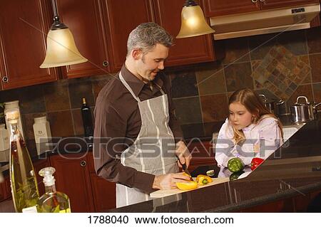 Stock Image - Dad's cooking. Fotosearch