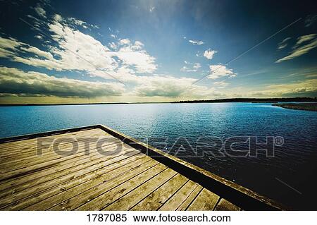 Dock overlooking a lake View Large Photo Image Stock Photography - Dock overlooking a lake. Fotosearch