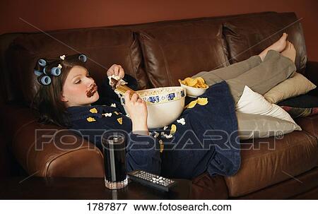 Eating junk food View Large Photo Image Stock Photo - Eating junk food. Fotosearch