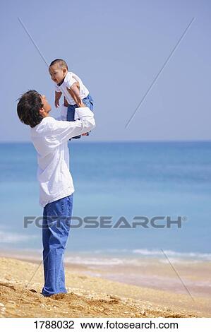 Father holding up child View Large Photo Image Stock Image - Father holding up child. Fotosearch