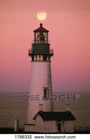 Stock Image - Full moon over lighthouse. Fotosearch