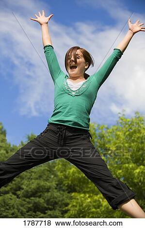 Girl jumping for joy View Large Photo Image Stock Photo - Girl jumping for joy. Fotosearch
