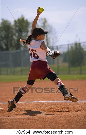 Girl winding up to pitch View Large Photo Image Picture - Girl winding up to pitch. Fotosearch