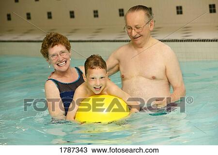 Grandparents and grandson in swimming pool View Large Photo Image Stock Image - Grandparents and grandson in swimming pool. Fotosearch
