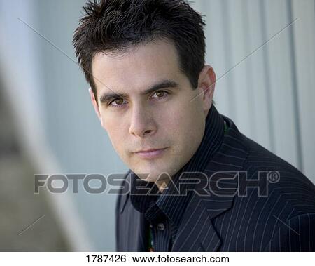 Stock Photograph - Handsome man in a pinstriped suit. Fotosearch