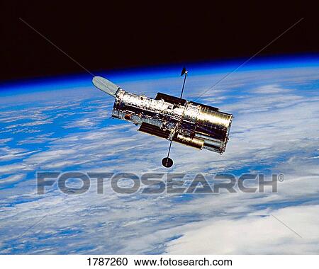 Stock Image - Hubble space telescope in orbit. Fotosearch