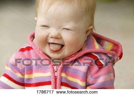 Laughing baby girl View Large Photo Image Stock Photo - Laughing baby girl. Fotosearch