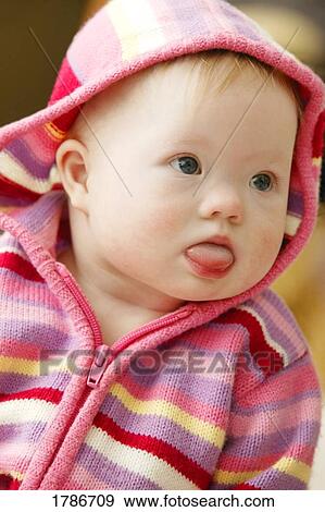 Little baby with tounge out View Large Photo Image Stock Photo - Little baby with tounge out. Fotosearch